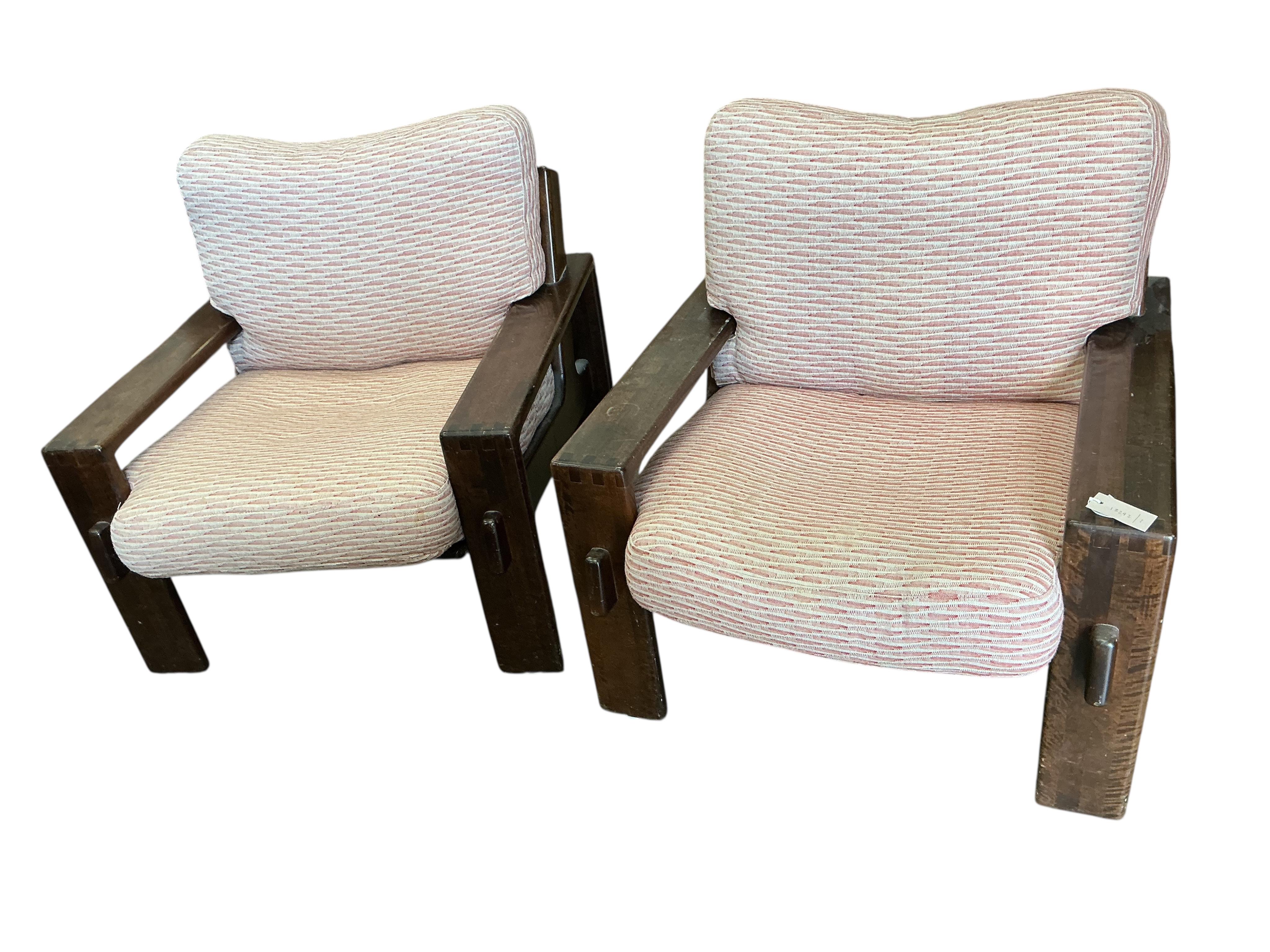 A pair of Arts & Crafts style walnut armchairs with loose cushion seats and backs, width 80cm, depth 80cm, height 85cm